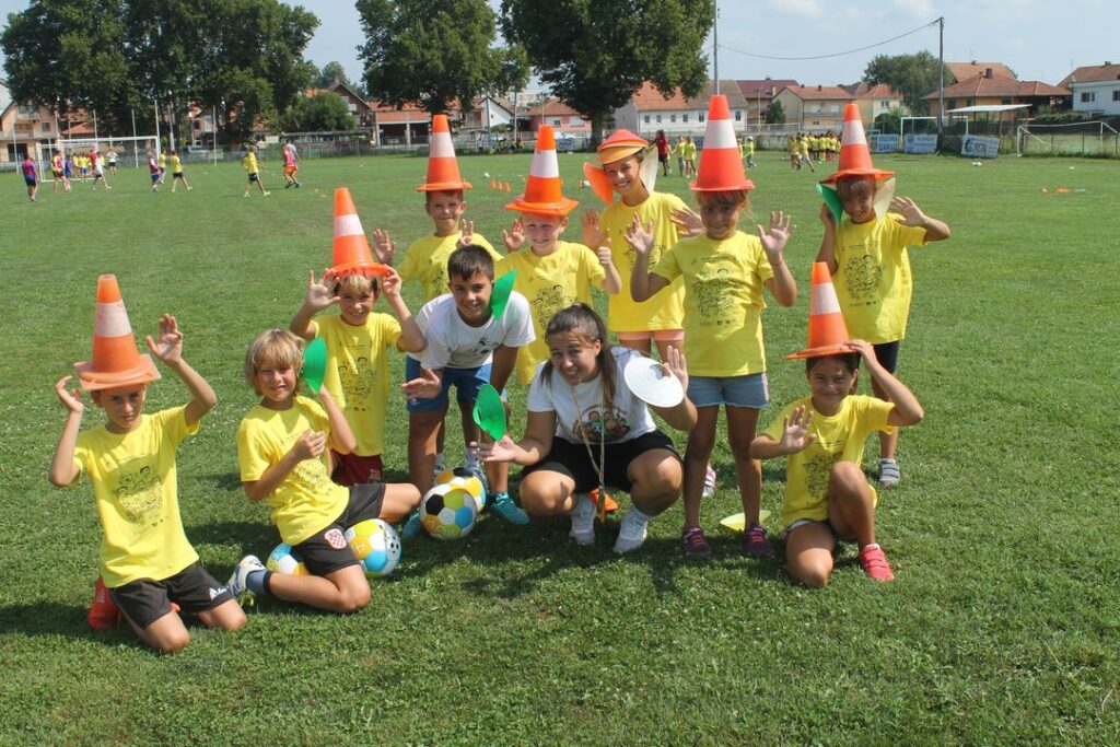 Tamara Benkovic with kids at Cross Cultures' Open Fun Football Schools